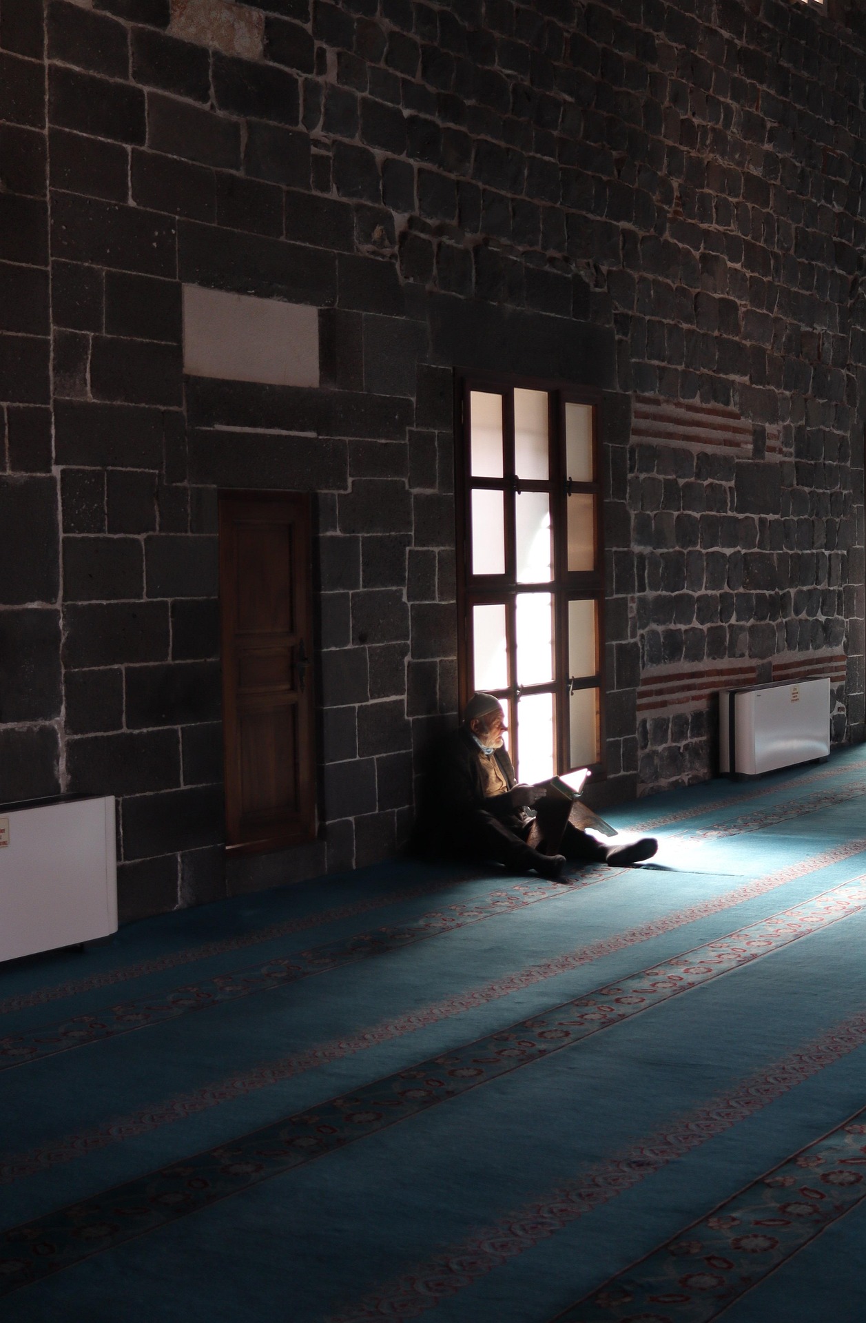 Muslims learning Quran together in a mosque